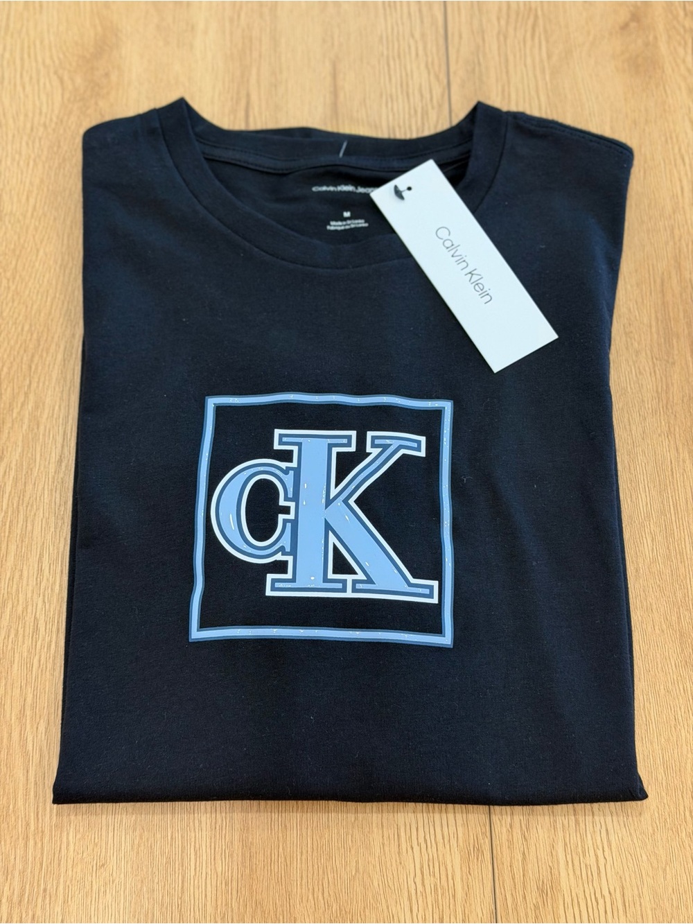 Calvin Klein Black T-Shirt with Light Blue CK Emblem